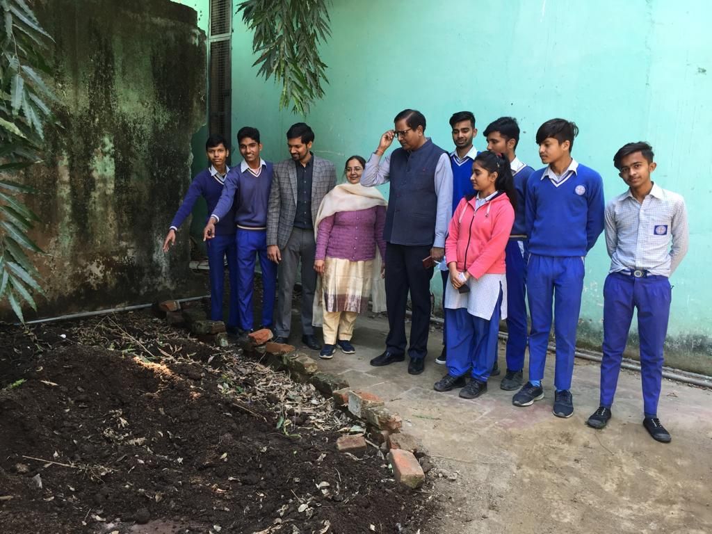 Reviewing one team's composting venture on the school grounds
